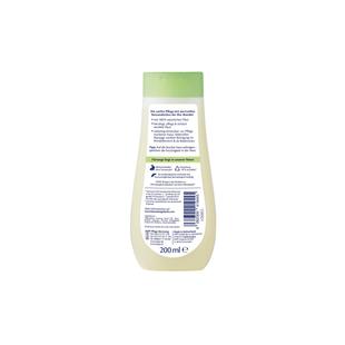 Flasche mit grünem Verschluss und weißem Etikett mit Text auf der Rückseite