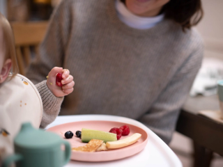 Baby playing with food
