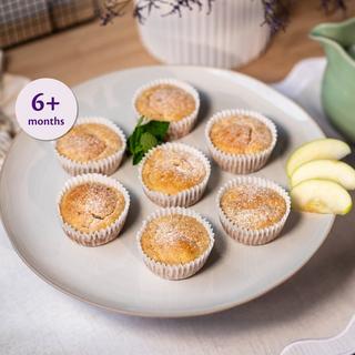 Plate of apple and banana muffins for babies 6+ months, dusted with sugar and served with apple slices