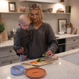 Mum prepping vegetables for baby led weaning