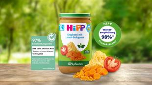 HiPP 100% pflanzlich Menü „Spaghetti mit Linsen-Bolognese“ im Glas mit Gemüsezutaten, 97–98 % Empfehlungssiegeln und BIO-Hinweis.