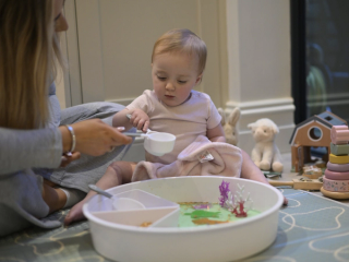 Baby playing with sensory tray