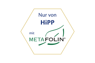 Sechseckiges HiPP-Siegel mit der Aufschrift „Nur von HiPP mit Metafolin®“ und grünem Blatt-Symbol für Premium-Folatquelle.