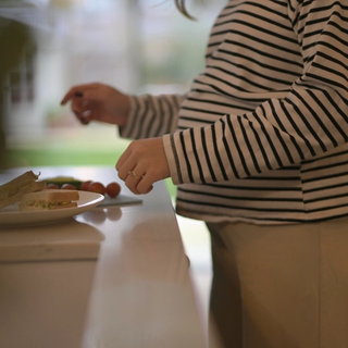 Expecting mum preparing her lunch