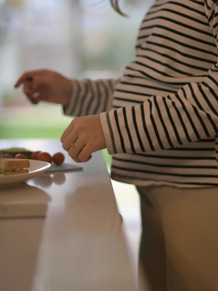 Expecting mum preparing her lunch