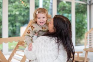Mum and baby smiling