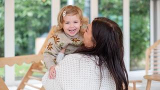 Mum and baby smiling