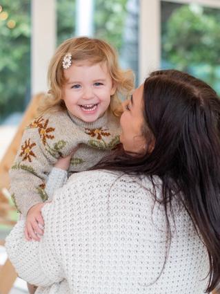 mom and baby smiling