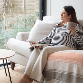 Expecting mum drinking a cup of tea