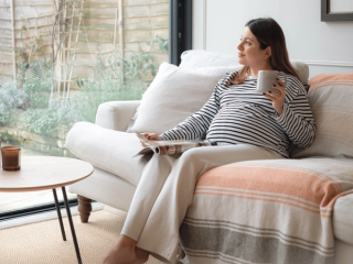 Expecting mum drinking a cup of tea