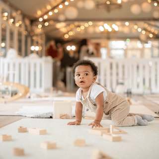 Baby playing with wooden blocks