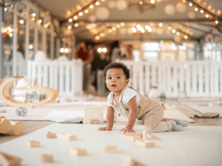 Baby playing with wooden blocks