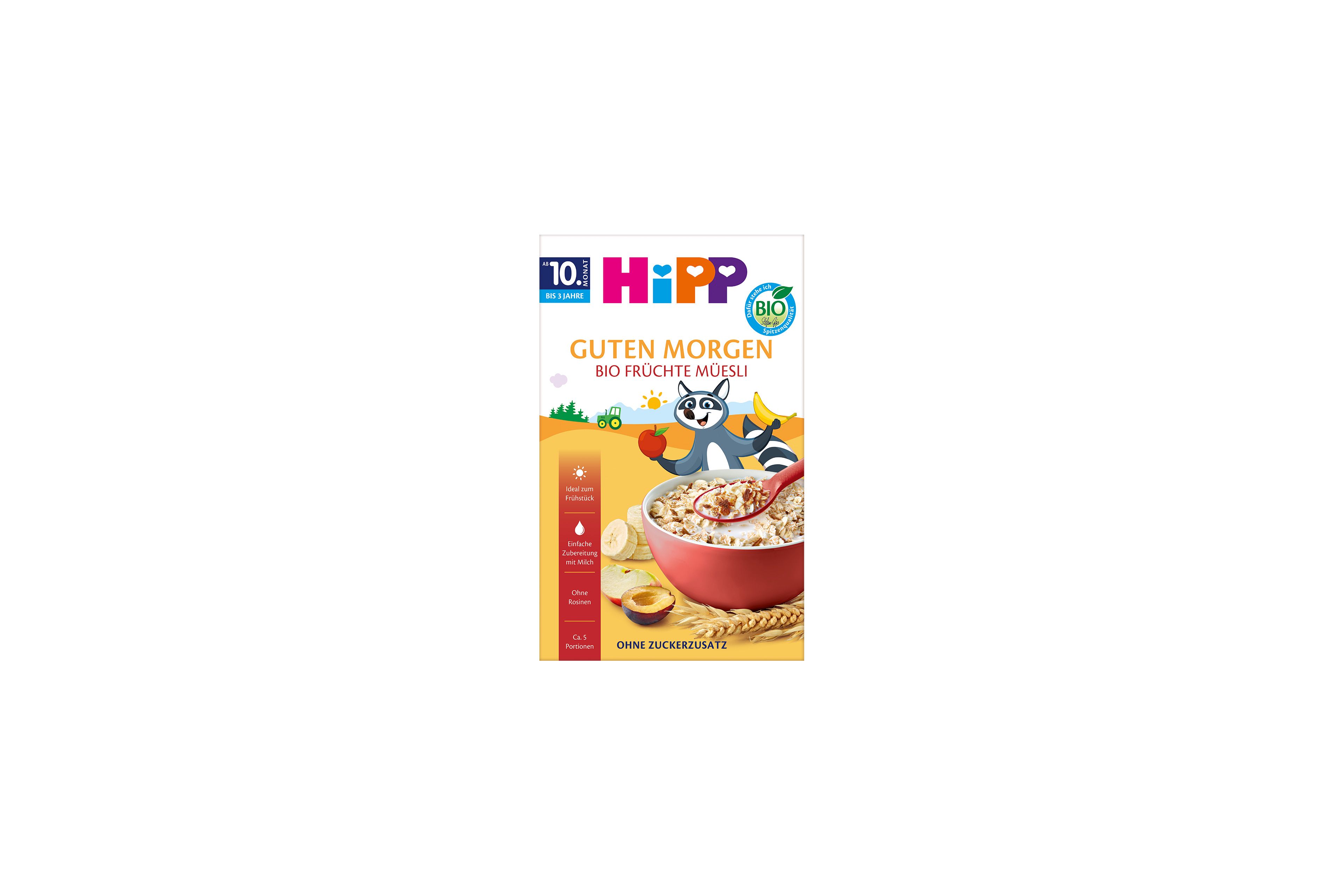 HiPP Guten Morgen Bio Früchte-Müesli Packung mit roter Müslischale, Obststücken und fröhlichem Waschbär-Maskottchen