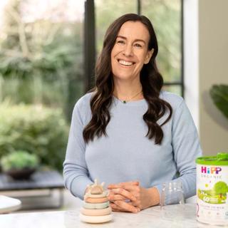 Woman preparing a bottle of follow-on milk