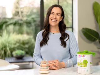 Woman preparing a bottle of follow-on milk