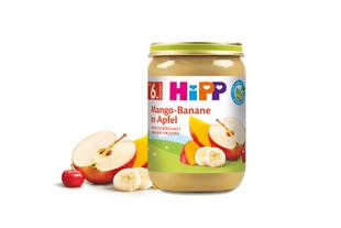 Ein Gläschen Babynahrung mit der Aufschrift "Mango-Banane in Apfel" mit einem Etikett "6 Monate", einem "BIO"-Etikett und einem "STEFAN"-Logo.