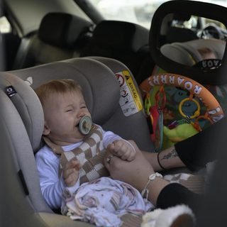 Baby crying whilst being put in car seat