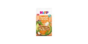 HiPP Crunchy Crocos Apfel-Zimt Bio-Kinder-Müsli mit fröhlichem Krokodil-Maskottchen auf orangefarbener Verpackung