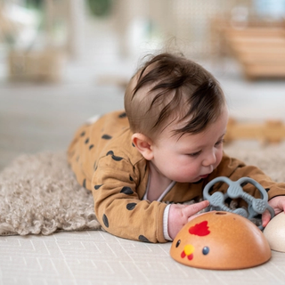 6 month old baby having tummy time