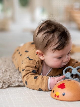 6 month old baby having tummy time