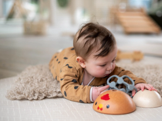 6 month old baby having tummy time