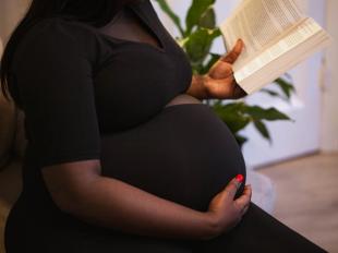 Pregnant woman reading a book