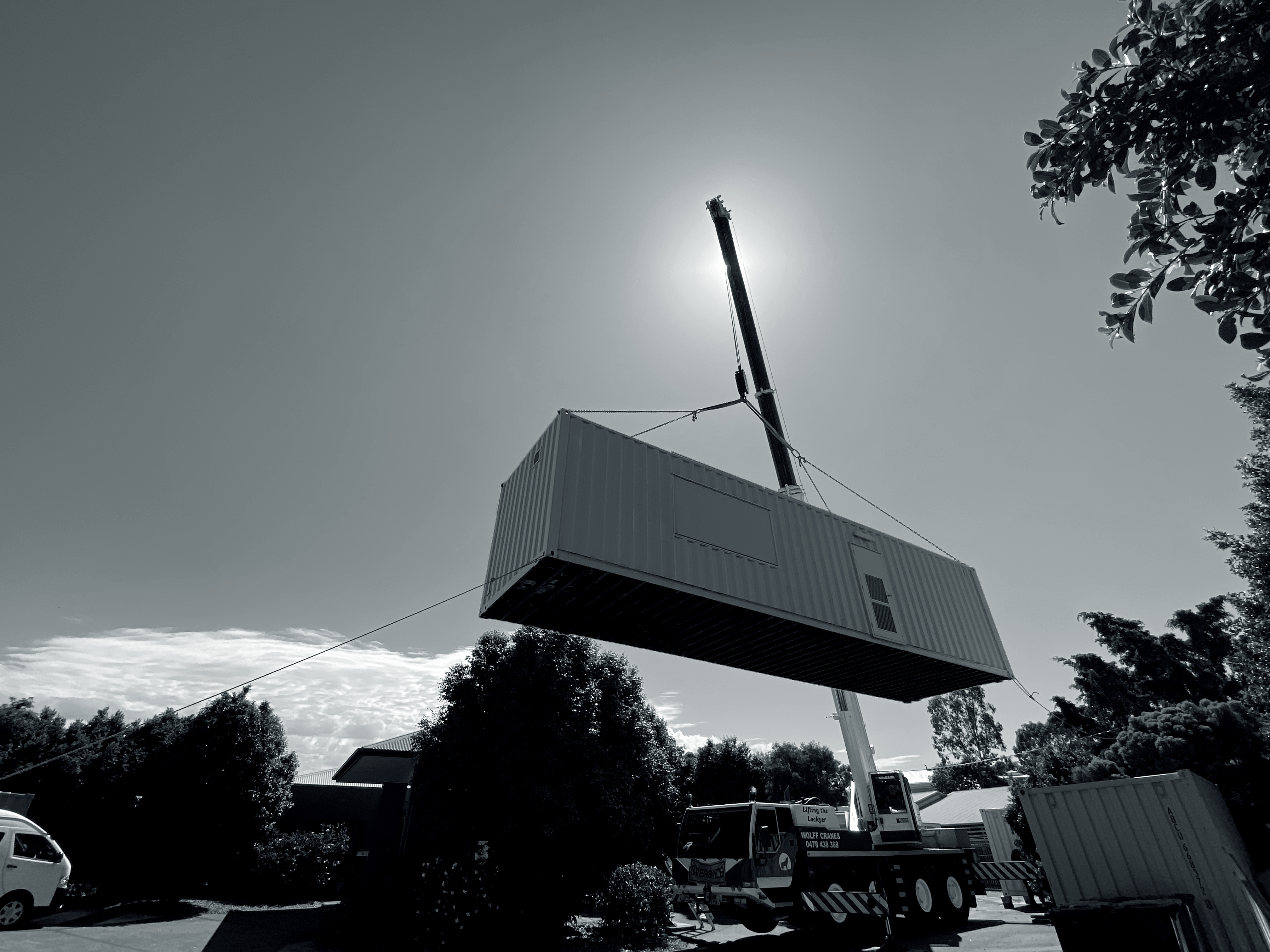 Container delivery with crane for positioning at aged care site in Australia for temporary kitchen during main facility refurbishment