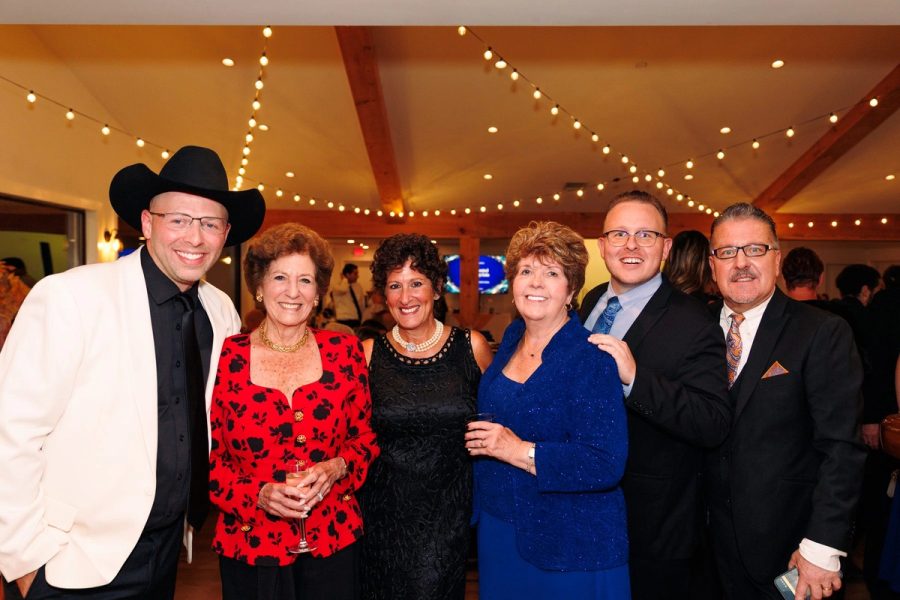 A group of guests under the string lights