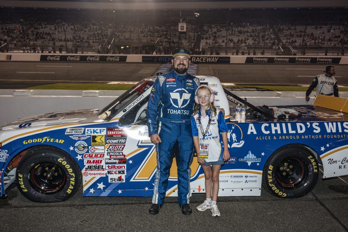 Spencer Boyd with Ashlyn beside the truck