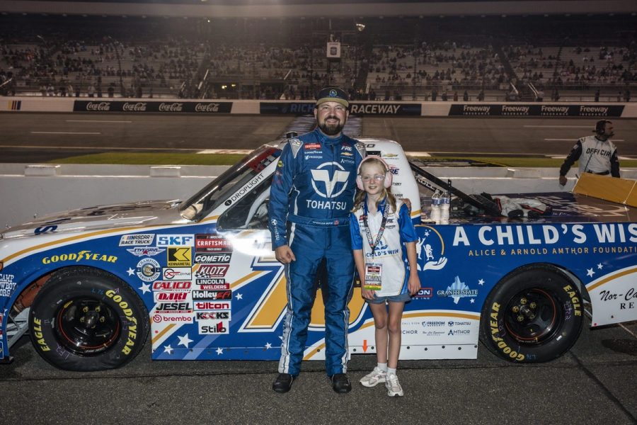 Spencer Boyd with Ashlyn beside the truck