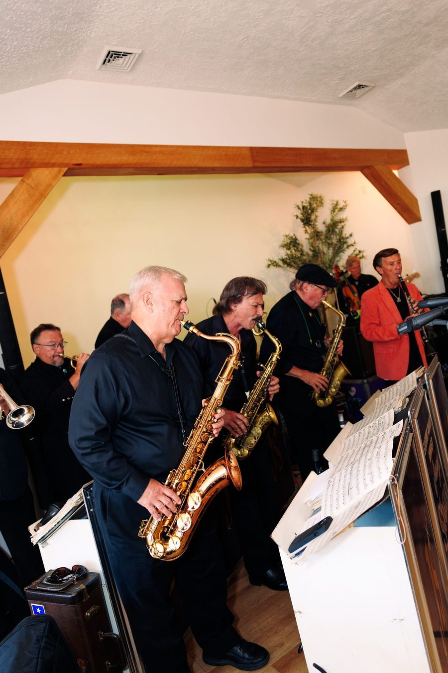 The orchestra plays as guests arrive