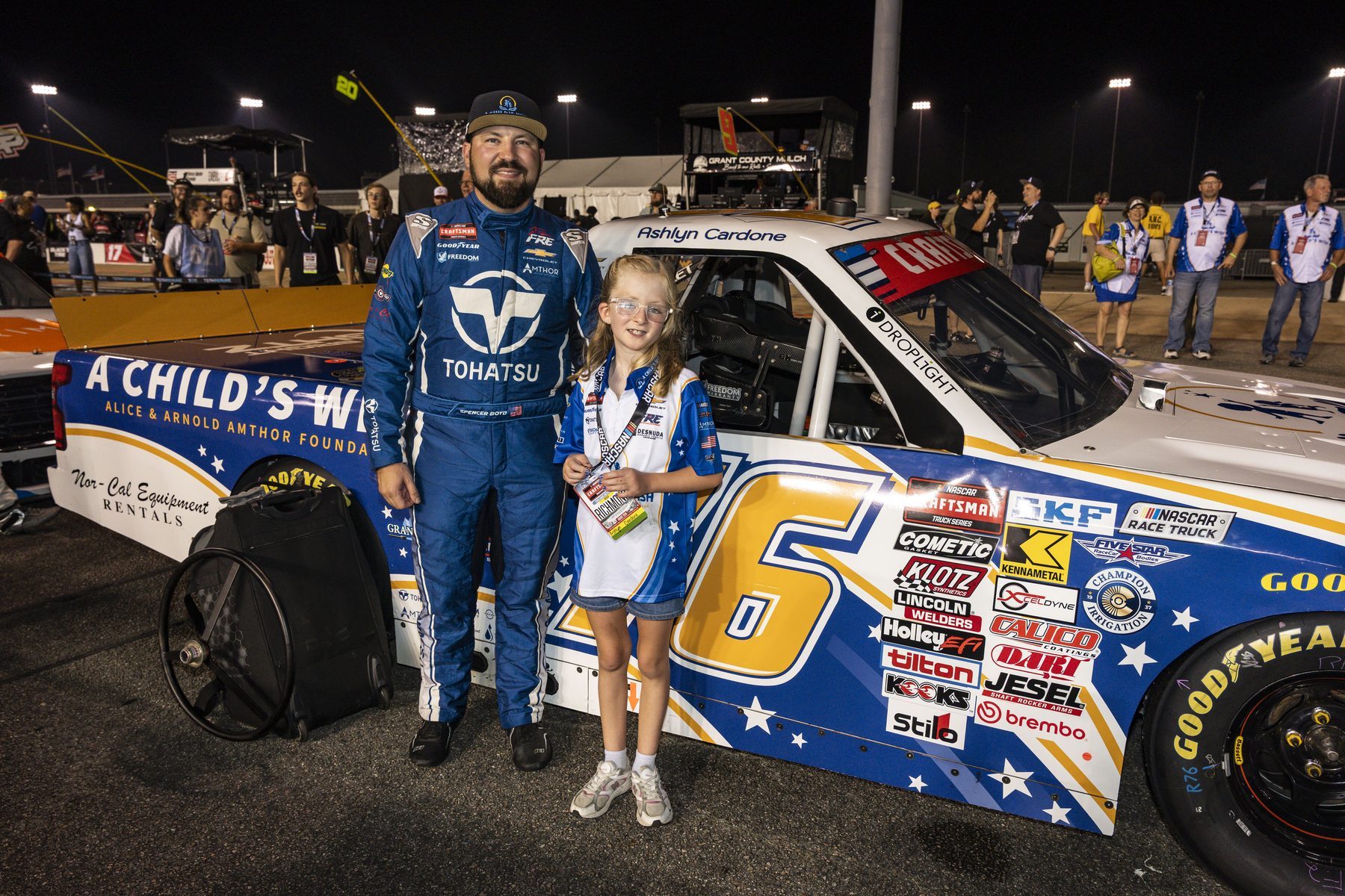 Spencer Boyd and Ashlyn beside the No. 76 A Child's Wish truck at Richmond Raceway