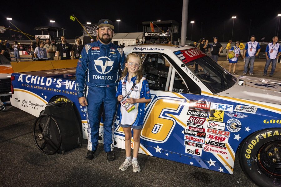 Spencer Boyd and Ashlyn beside the No. 76 A Child's Wish truck at Richmond Raceway