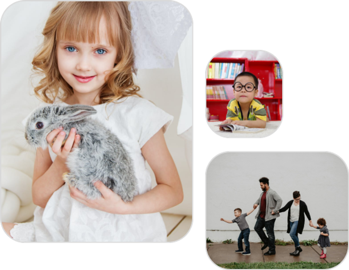 A girl holding a bunny, with a family and a child reading