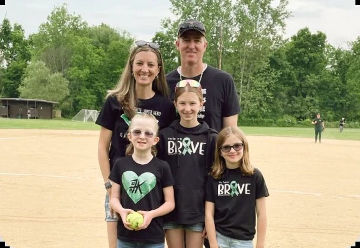 Ashlynn and family on the field before the first pitch