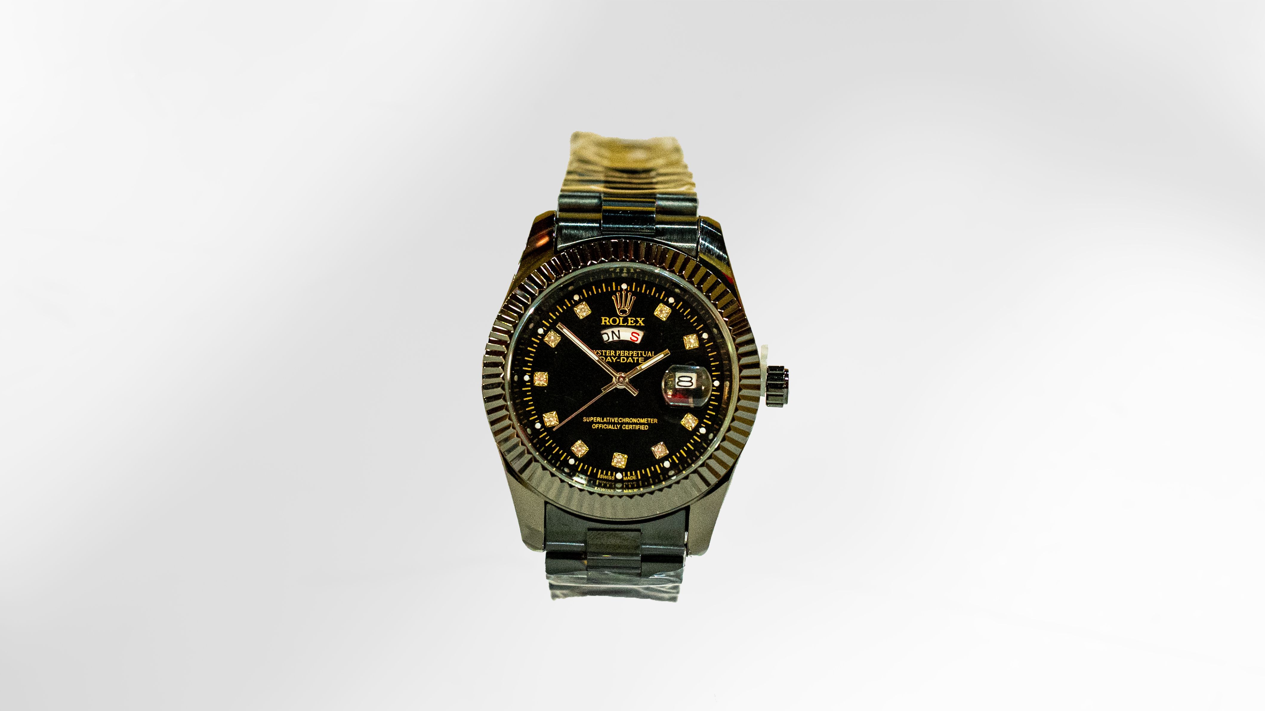 Rolex: Day-Date Gunmetal Red Calendar Diamond Dial