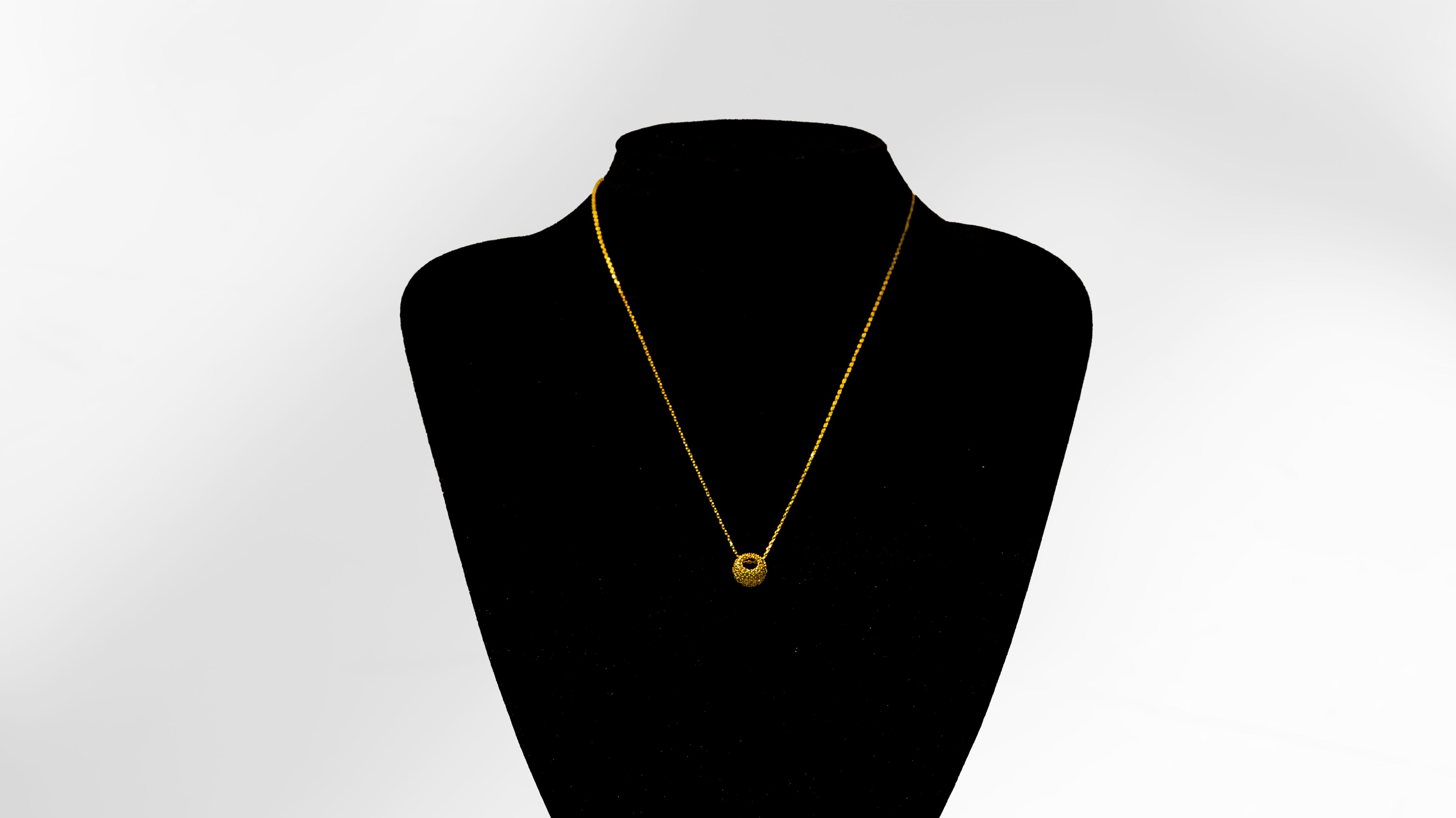 Golden Pebble Pendant Necklace