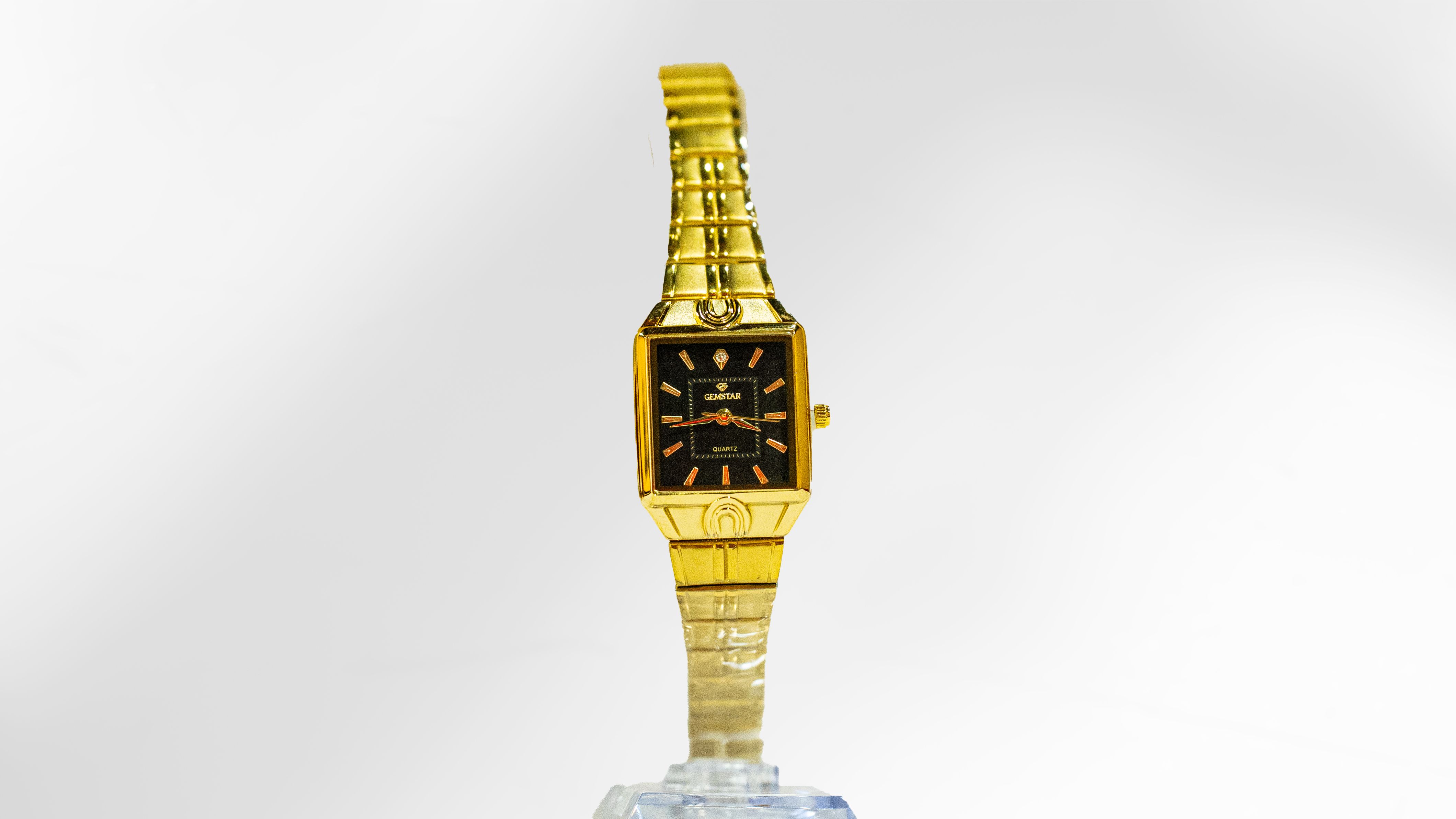 Gemstar Ladies Rectangle Black Dial Gold