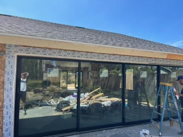 4-panel multi-track sliding glass door installed on a new-construction Temecula home — exterior view
