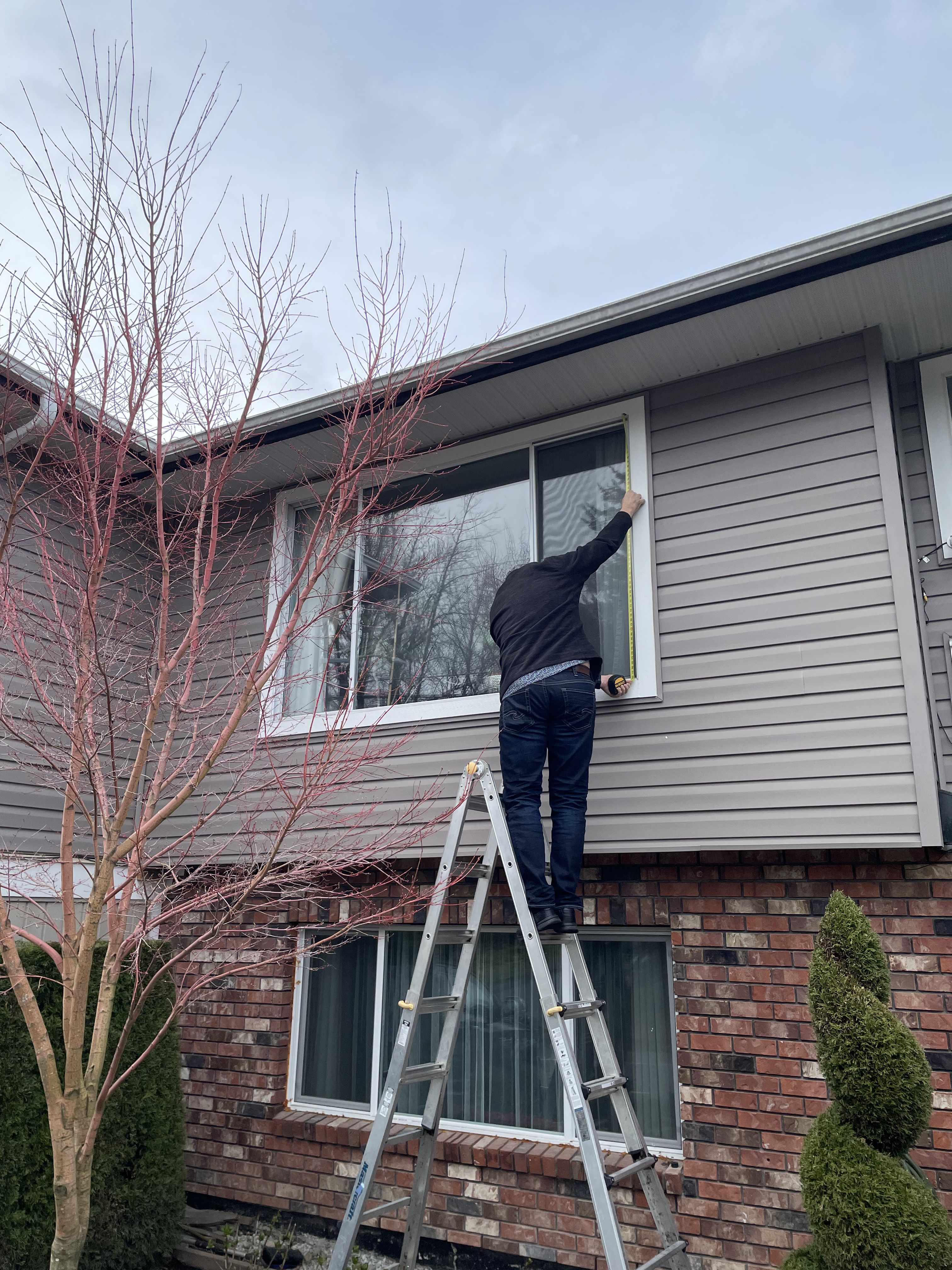 Dual-pane vinyl window frame detail during install