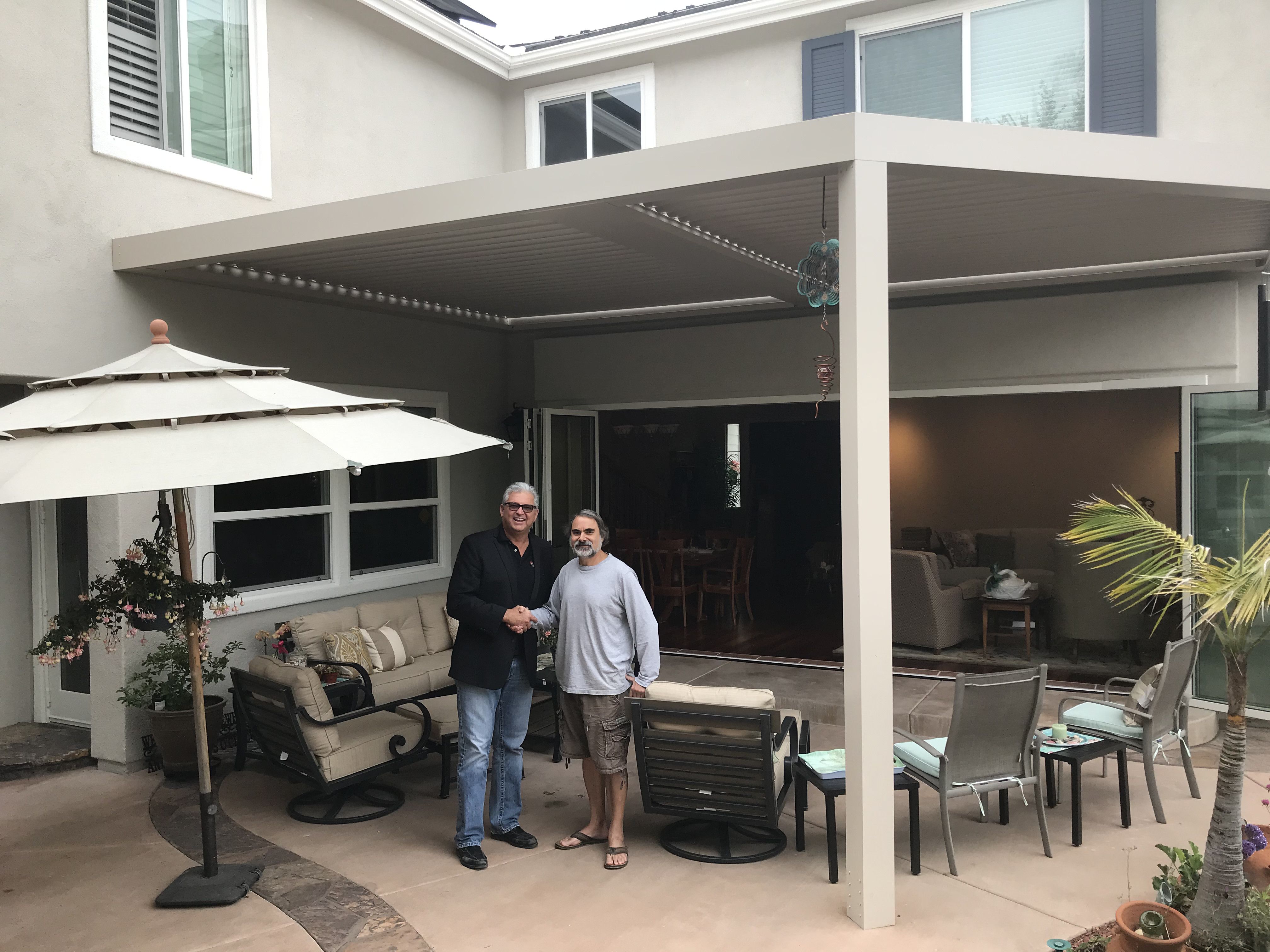 Backyard reveal through a multi-panel folding glass door