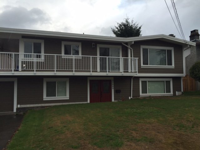 Two-story home with finished fiberglass front entry and aluminum picket balcony rail