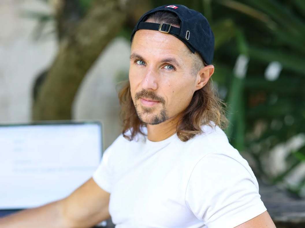 Business consultant Ted Carr, an online entrepreneur and mentor, photographed outdoors in casual attire, showing his approachable personality and professional confidence.