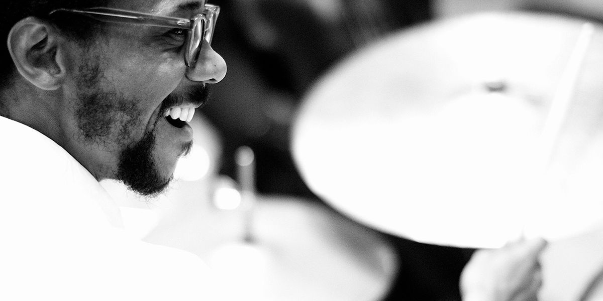 Black and white picture of Brian Blade playing drums