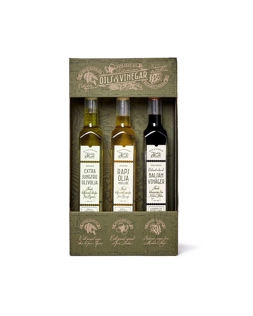 Tre små flaskor med olivolja, rapsolja med lime och balsamvinäger i en grön, dekorativ presentförpackning.