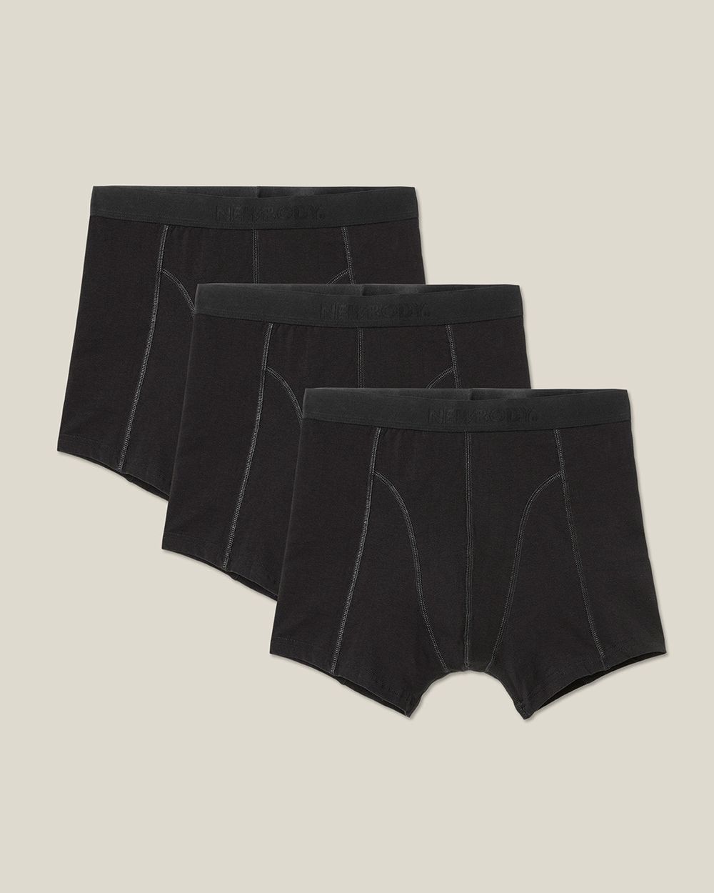 Tre svarta kalsonger med resår i midjan av ett mjukt bomullsmaterial