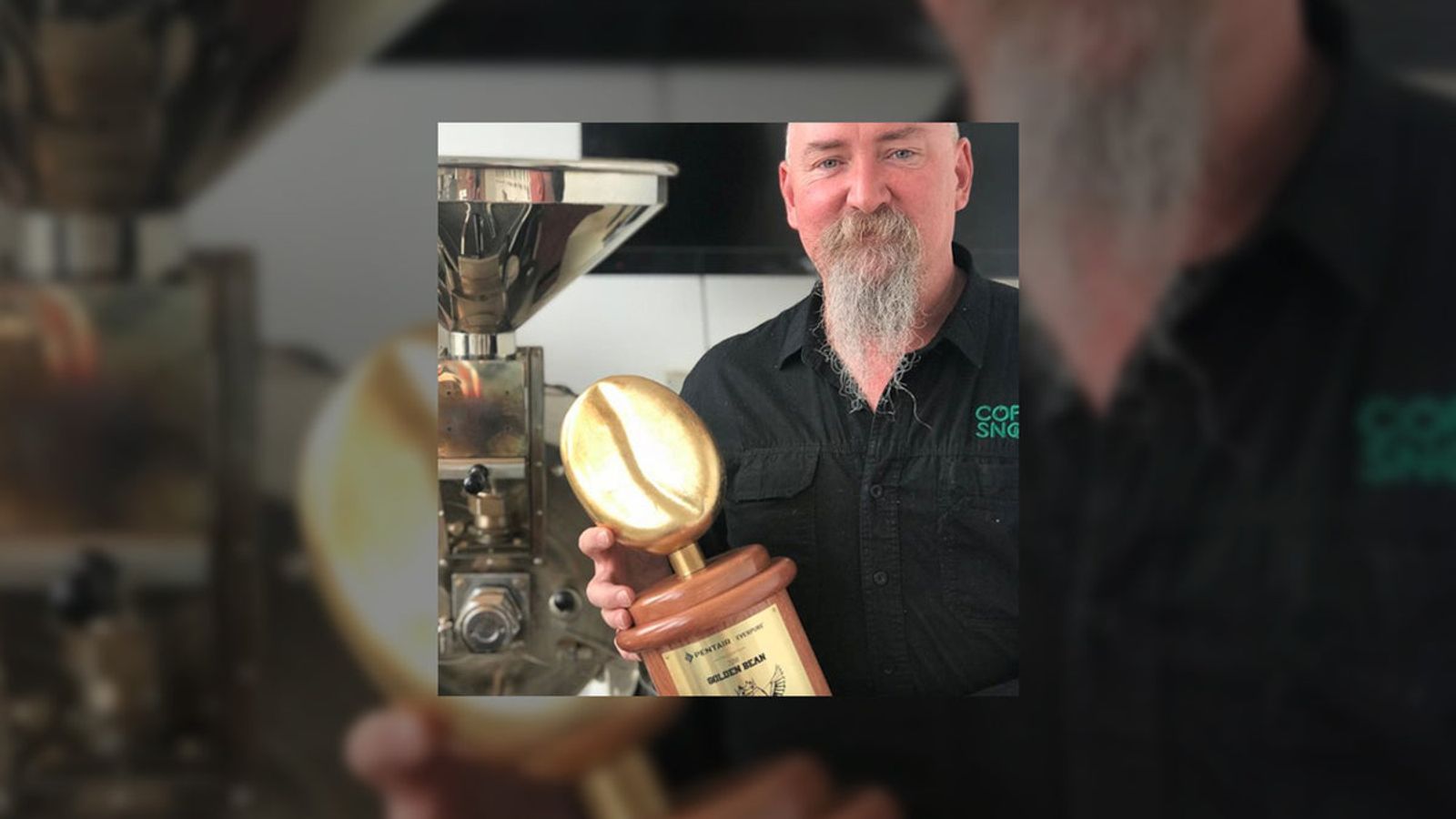 Andy Freeman of Coffee Snobs with the 2021 Golden Bean Overall Champion trophy