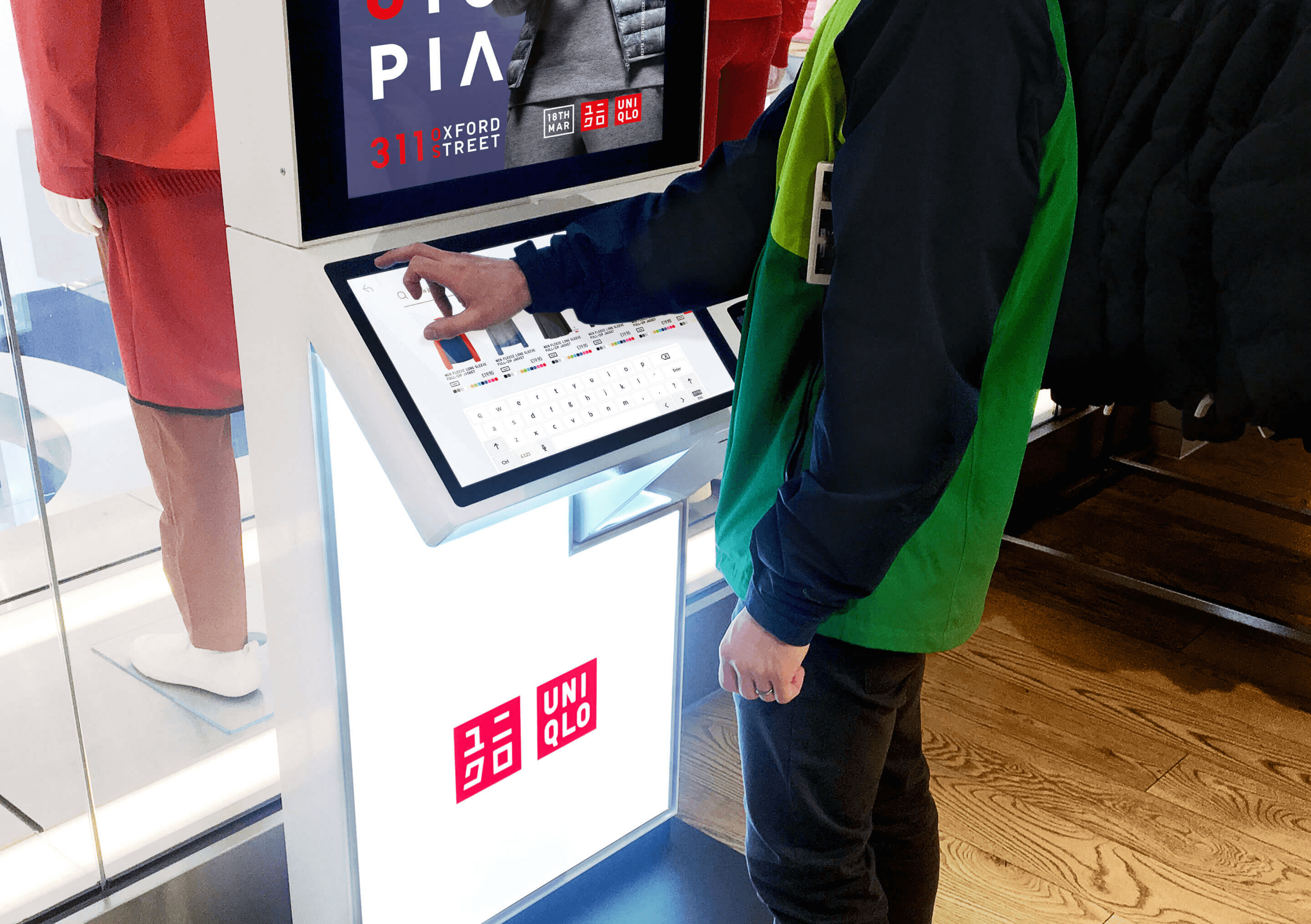 A customer is seen using the kiosk in the Oxford St store in London