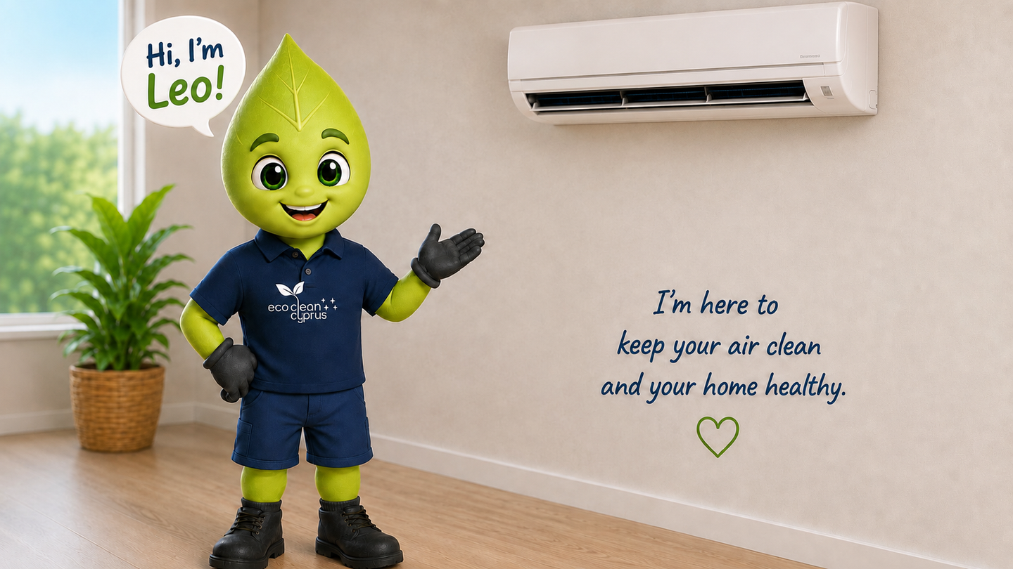 Leo from Eco-Clean Cyprus beside a wall-mounted air conditioner