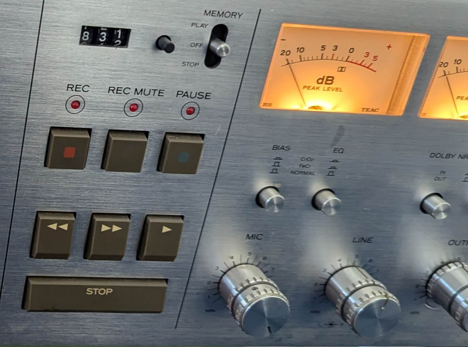 Teac silverfaced tapedeck with orange glowing vu meters